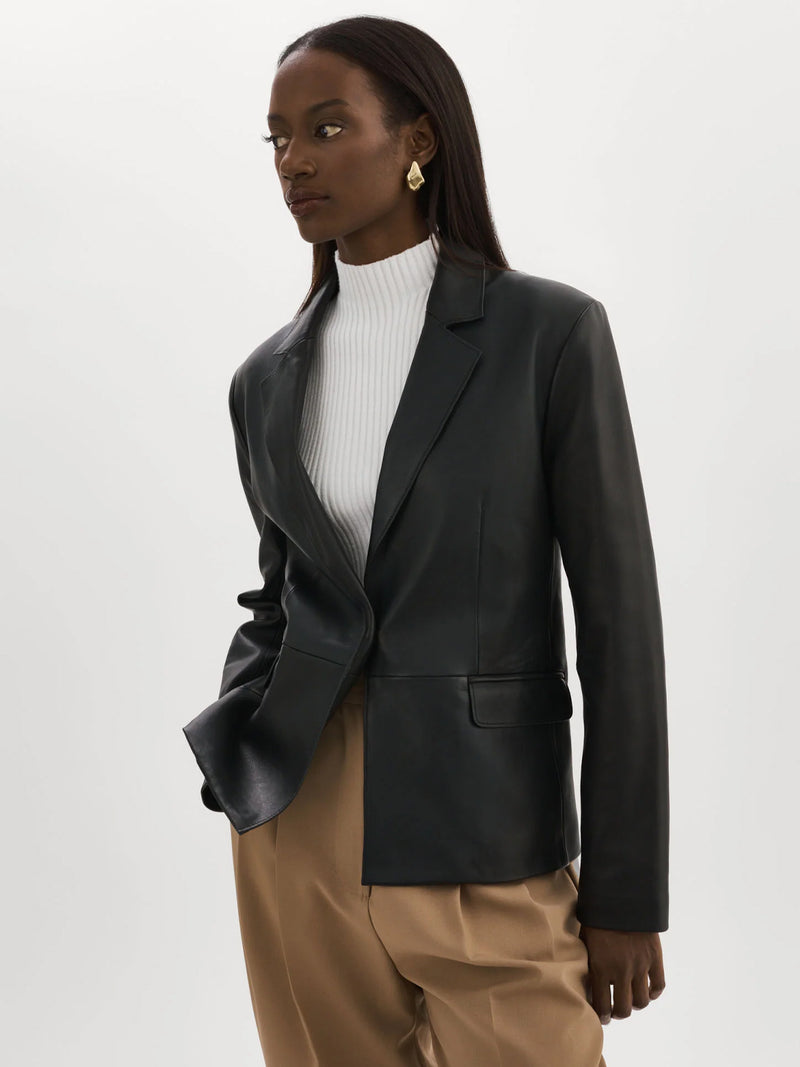 Woman wearing the Elza Leather Blazer in Black.