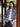 Woman wearing a plaid button down.