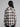 Woman wearing a plaid button down.