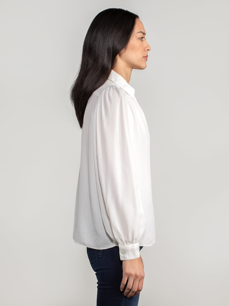 Woman wearing the Abigail Blouse by Margaret O'Leary.