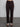 Woman wearing brown corduroy pants.