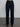 Woman wearing dark blue corduroy pants.