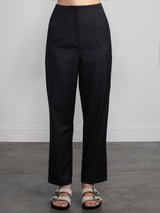 Female wearing black dress pants. 