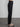 Female wearing black dress pants. 