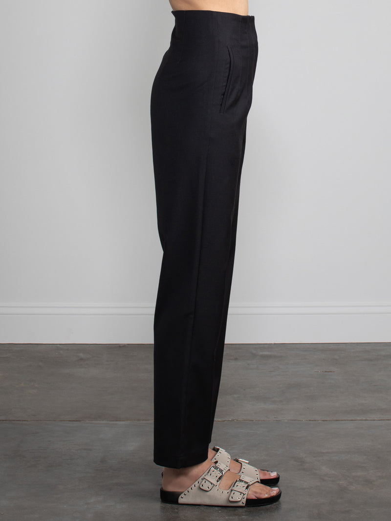 Female wearing black dress pants. 
