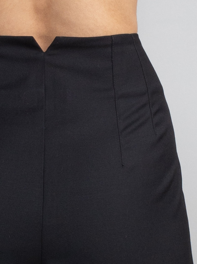 Female wearing black dress pants. 
