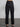 Female wearing black dress pants. 