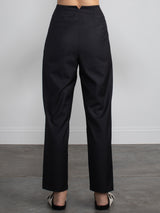 Female wearing black dress pants. 