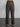 Female model wearing brown plaid dress pants