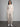 Woman wearing a matching sweatsuit.