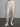 Woman wearing cream sweatpants.