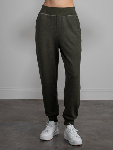 Woman wearing green sweatpants.