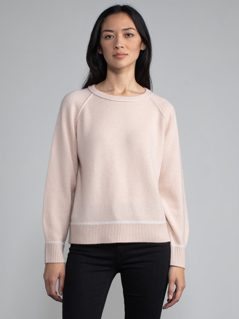 Female model in blue pannacotta cashmere sweatshirt