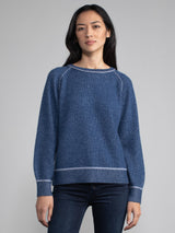 Female model in blue cashmere sweatshirt