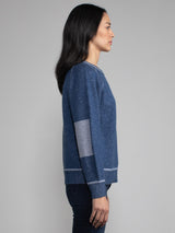 Female model in blue cashmere sweatshirt
