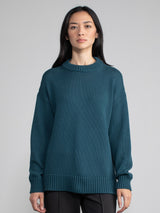 Women wearing an oversized sweater.