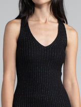 Woman wearing black sparkle dress. 