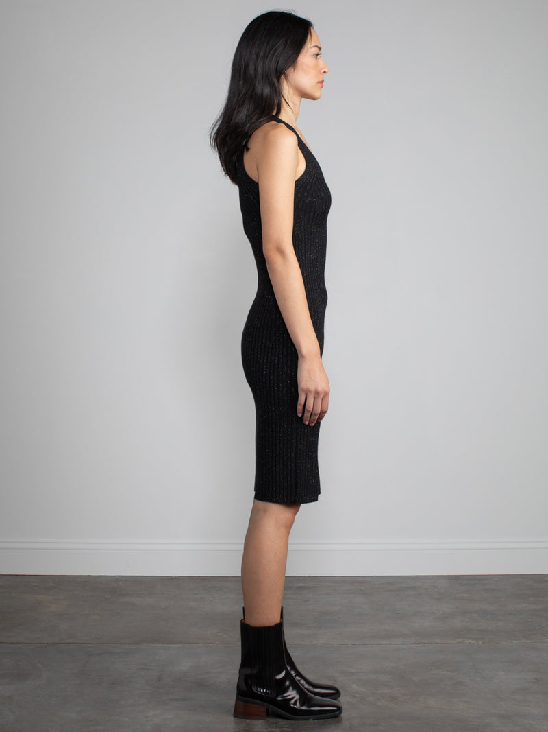 Woman wearing black sparkle dress. 