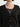 Close up of textured knit cashmere cardigan in black. 
