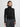 Woman wearing a black turtleneck sweater and gray pants on a white background
