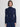 Woman wearing a navy Phoebe Mockneck longsleeve by Margaret O'Leary on a white background