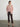 Margaret O’Leary blush pink cashmere camisole with matching cardigan, styled with brown pants.