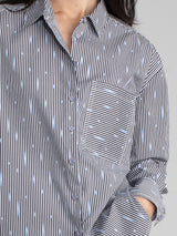 Woman wearing a cotton ikat shirt.