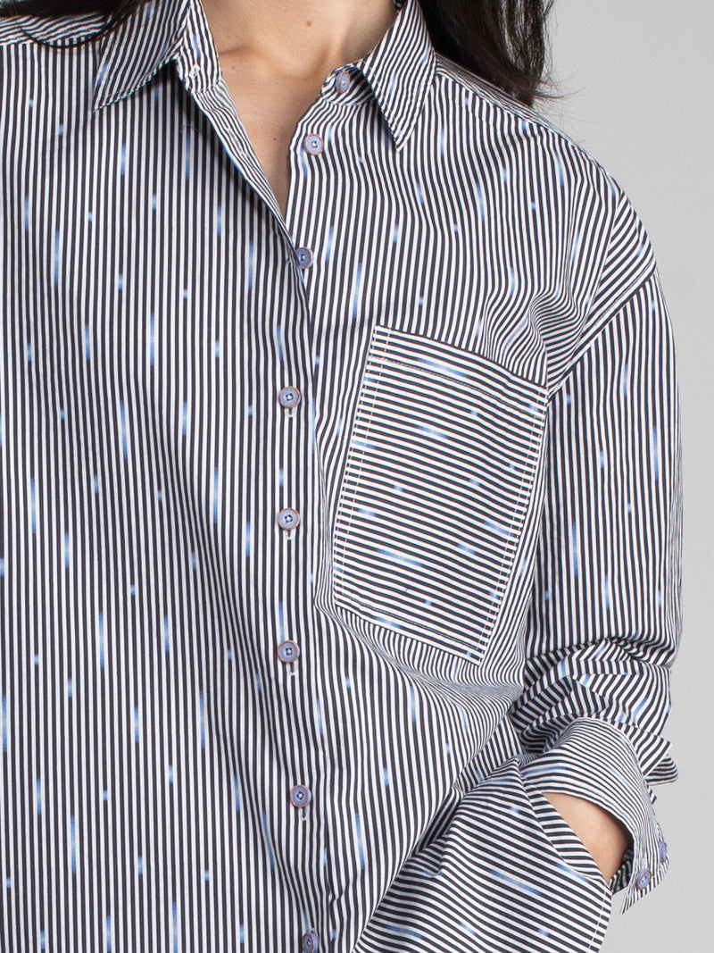 Woman wearing a cotton ikat shirt.