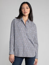 Woman wearing a cotton ikat shirt.