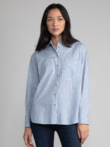 Woman wearing a cotton ikat shirt.