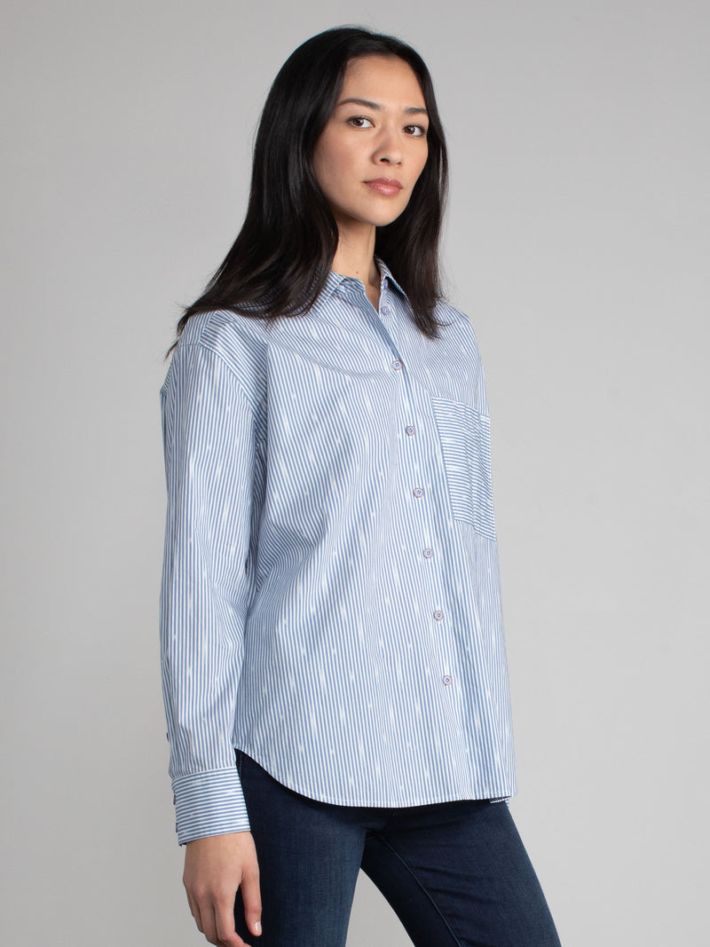 Woman wearing a cotton ikat shirt.