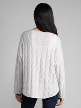 Woman wearing the Shirttail Cable Pullover in fog.