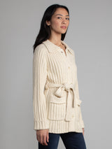 Woman wearing a white fleece button down jacket..