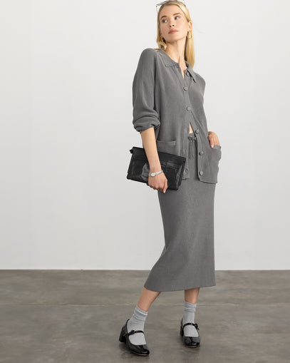 Woman wearing Ribbed Cotton Jacket and Ribbed Cotton Skirt in gunmetal made by Margaret O'Leary.
