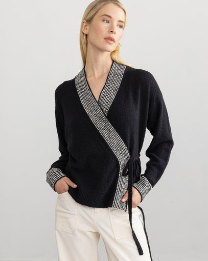 Woman wearing the Lily Wrap Cardi in black ivory and the Oliver Pant in muslin made by Margaret O'Leary.