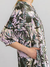 Woman wearing the Paola Printed Dress in Dark Tropical by Margaret O'Leary.