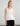 Woman wearing the Ribbed Cotton Tank in white by Margaret O'Leary.