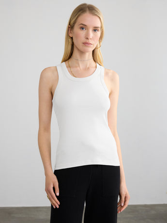 Woman wearing the Ribbed Cotton Tank in white by Margaret O'Leary.