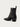 The Halmanera Taby zip boot, a black leather ankle boot with a zipper on a light gray background