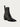 The Halmanera Taby zip boot, a black leather ankle boot with a zipper on a light gray background