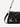 Margaret O'Leary Beverly medium black pebbled leather crossbody bag with gold rivets and dual straps.