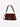 Margaret O'Leary Beverly Medium bag in cherrywood pebbled leather with gold hardware, dual straps, and paneling details.