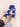 Blue socks with white polka dots by Hansel from Basel, worn by a person on a beige background