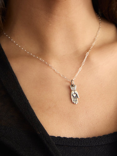The Hand with Hearth Necklace by Feathered Soul.