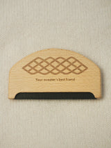 Wooden sweater comb.