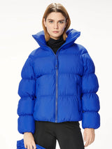 Woman wearing a blue puffer jacket.