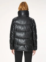 Woman wearing a black puffer jacket.