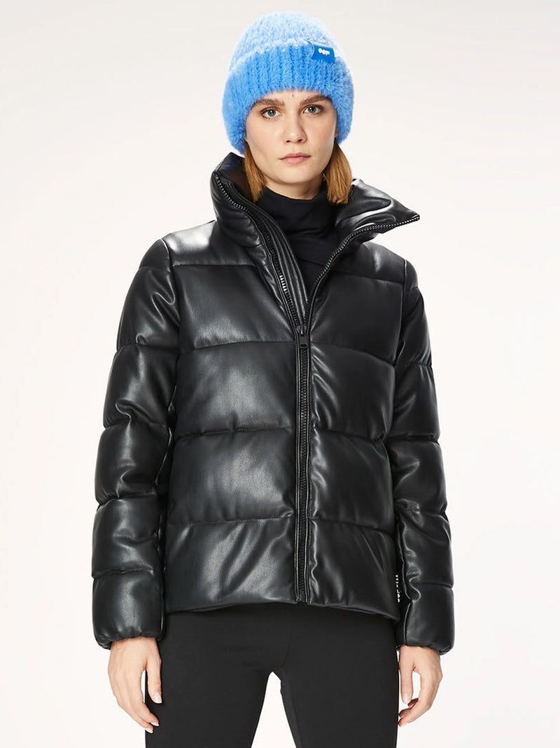 Woman wearing a black puffer jacket.
