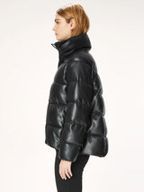 Woman wearing a black puffer jacket.