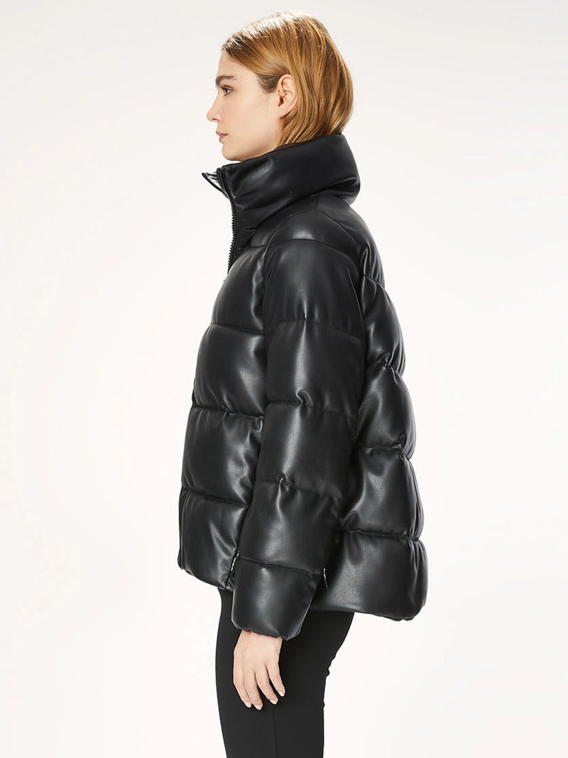 Woman wearing a black puffer jacket.